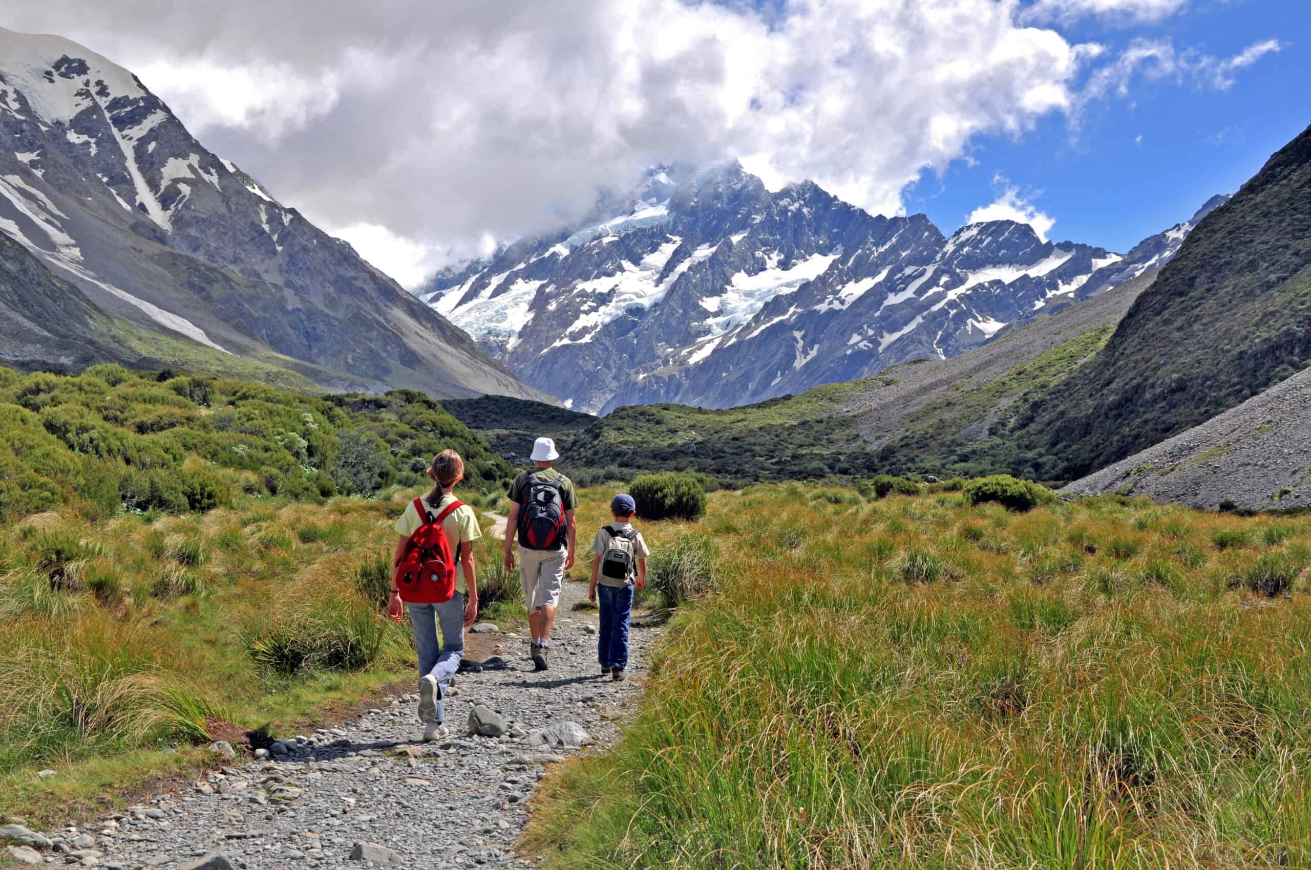 Family hiking towards Mt Cook, New Zealand