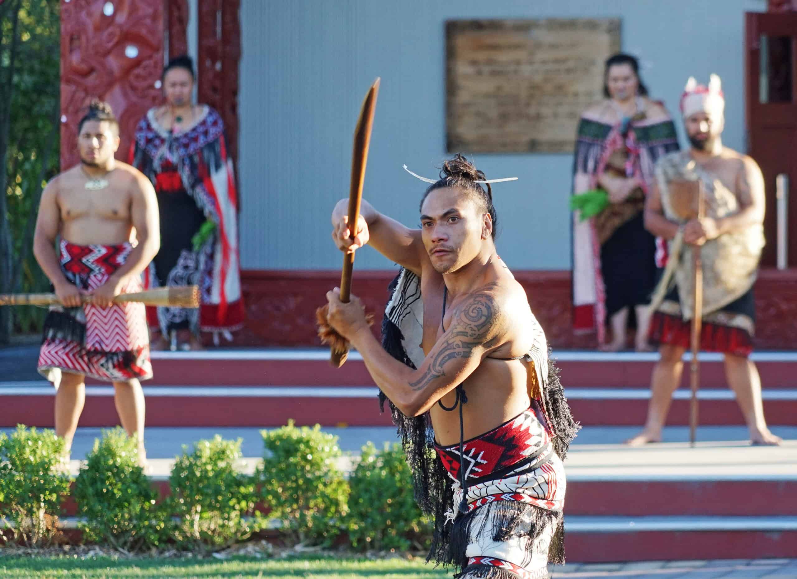 Group of Māori men performing a welcoming dance